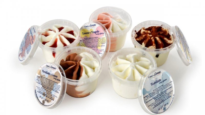 Plastic transparent cup with spoon under the lid